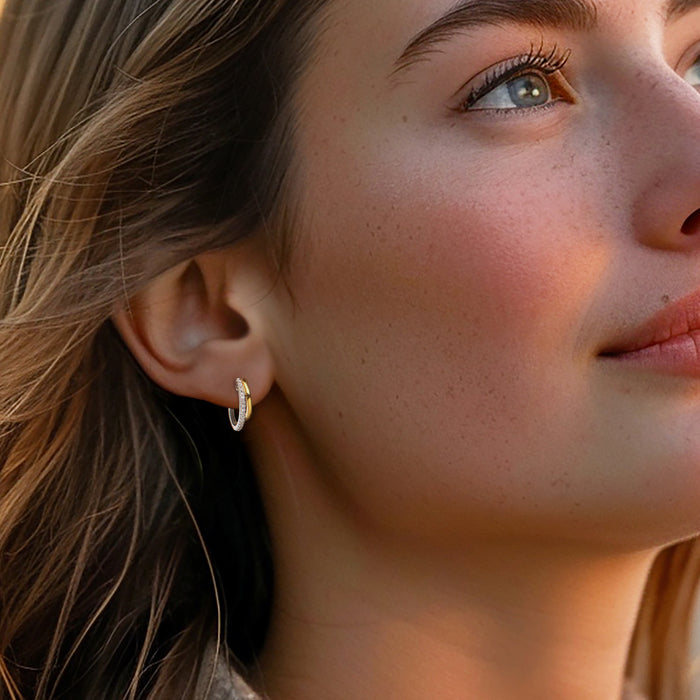 Two-tone diamond hoop earrings on model, gold inner hoop with silver outer hoop