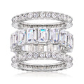 Three sterling silver CZ eternity bands stacked, with round and baguette-style stones