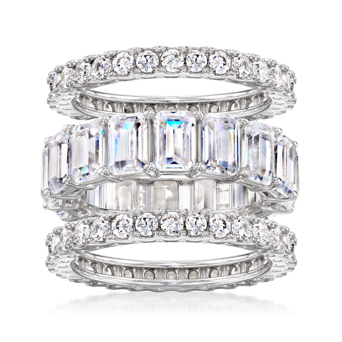 Three sterling silver CZ eternity bands stacked, with round and baguette-style stones
