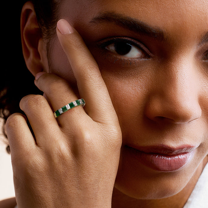 Emerald-green and diamond ring on finger, 18kt gold over sterling