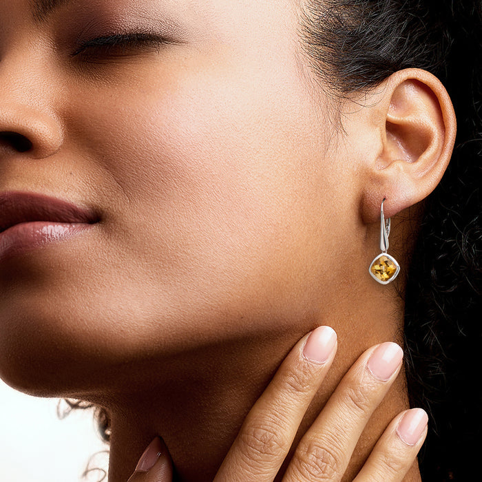 Ear with sterling silver leverback drop earrings with yellow citrine stones