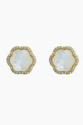 The ASHA Clementine Stud Earrings are crafted in 14k vermeil with scalloped edges, featuring a central mother of pearl surrounded by small clear gemstones.