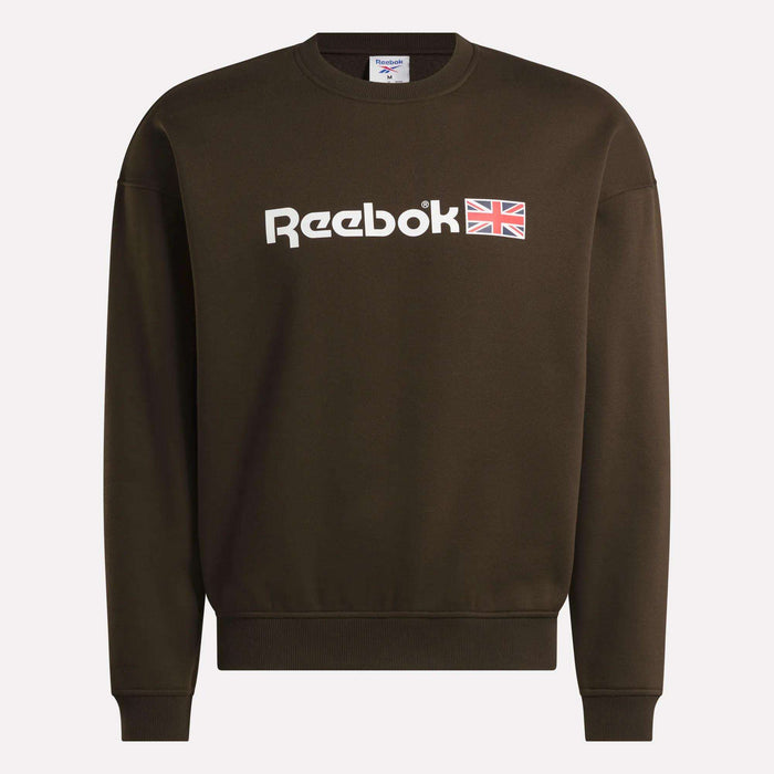 A dark brown Reebok Crewneck Sweatshirt showcasing the brand’s logo and a small Union Jack emblem on the front. This sweatshirt features a relaxed fit, long sleeves, and a classic crew neckline.