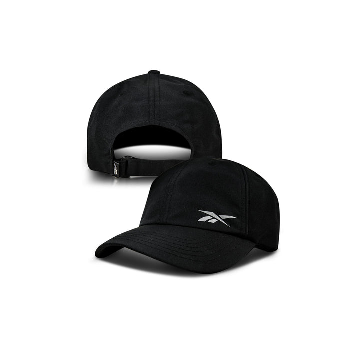 Two black Reebok Flow Piped Caps are displayed from different angles: one shows the front with a white Reebok logo, while the other shows the back with an adjustable strap and buckle. Includes a moisture-wicking sweatband for comfort.