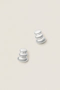 High Polish Silver Non-Stop Earrings feature classic, three-tiered, reflective forms. Effortless and bold, these fun, high-end pieces add drama and sophistication to any look.