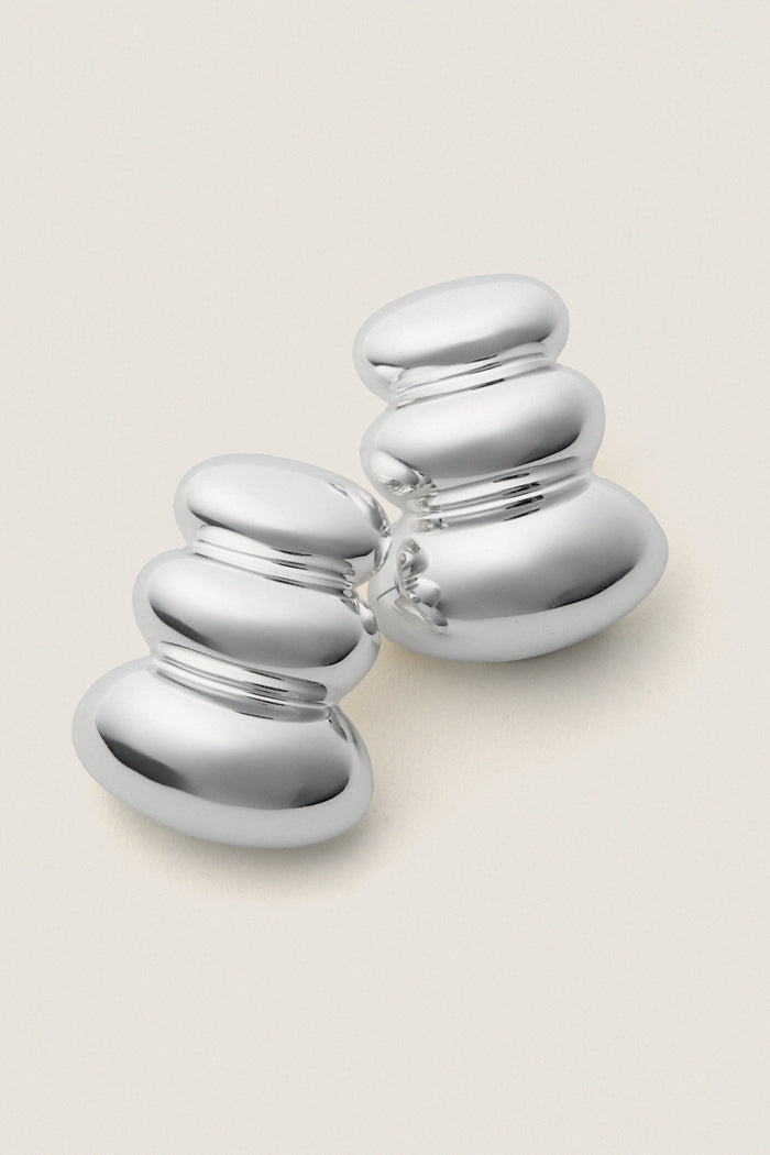 High Polish Silver Non-Stop Earrings; two sleek, polished chrome-like sculptures stacked elegantly, embodying a classic, effortless, and high-end style for a fun, confident look.
