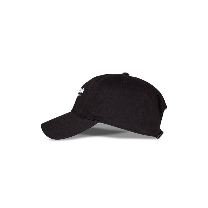 A side view of the Reebok Logo Cap in black cotton twill with a curved brim, adjustable buckle closure, and a partially visible Reebok logo on the front, placed against a white background.