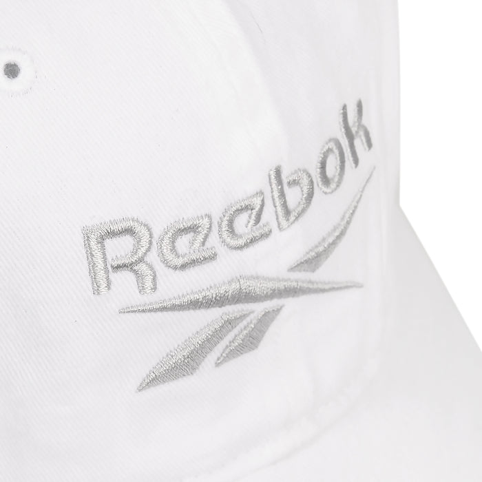 Close-up of the Reebok Logo Cap, crafted from cotton twill with silver embroidered text on the front and an adjustable buckle closure for a perfect fit.