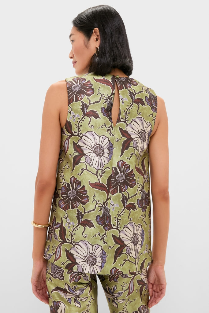 Woman models the classic Multi Citron Top with an effortless botanical print, featuring a stylish keyhole detail at back, paired with matching pants for a high-end, fun look.