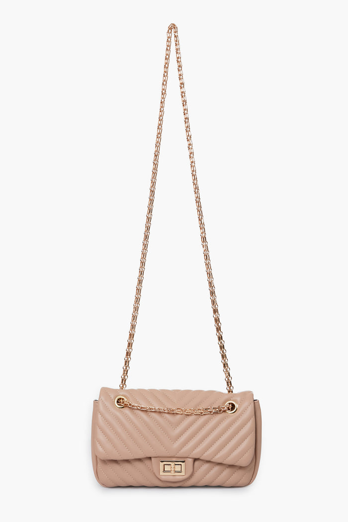Urban Expressions beige quilted vegan handbag features a gold chain strap and a rectangular gold clasp on the front flap.