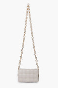The Urban Expressions small rectangular white crossbody bag features a woven pattern, long gold chain strap, and is crafted from animal-friendly materials.