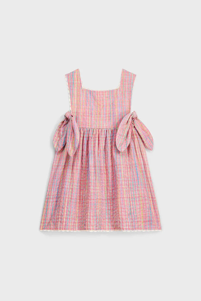 Pink Pomelo Checks Aloisa Dress: a classic, effortless sundress in lightweight seersucker gingham with fun ric-rac trim, side self-ties, and a high-end bohemian style.