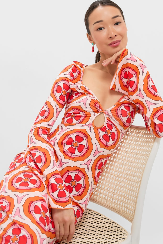 Young woman in a classic, high-end Pink Retro Radiance Diana Bell Maxi Dress, featuring effortless bell sleeves and keyhole detail, exuding fun and confidence.