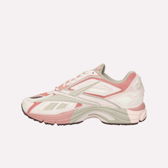 The Reebok Premier Road Ultra LTD Shoes are athletic sneakers in pink, white, and beige, inspired by archival running styles. They feature mesh and leather accents, a chunky sole with a dual-density midsole, and a lace-up closure, all displayed on a plain white background.