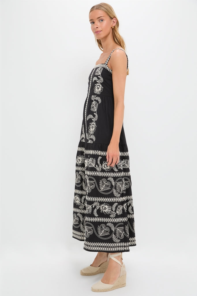 Sweetheart Rio Dress on model, showcasing an ankle-length, classic black sundress with effortless paisley embroidery. Styled with fun, high-end espadrille wedges, embodying Tuckernuck's cool confidence.