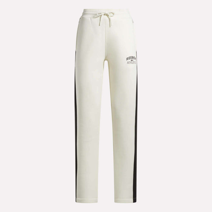 Crafted by Reebok, the Women’s Fleece Straight Leg Pants feature a crisp white design with black side stripes, an elastic waistband with drawstring closure, and Reebok Athletic branding on the left thigh. These cozy fleece pants are perfect for lounging in style against a plain background.